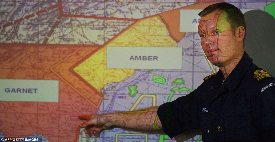 Plans: A Netherlands Lieutenant Commander explains details of the mission to sailors